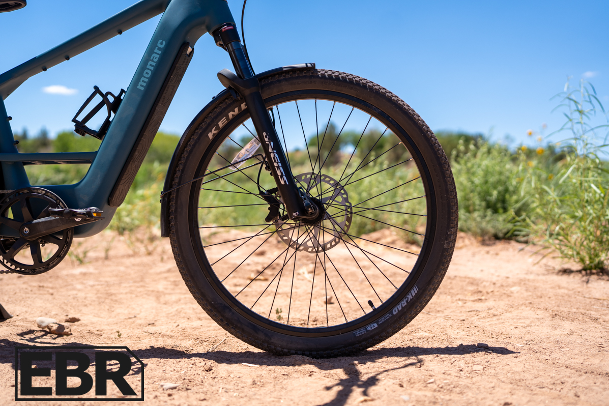Monarc Tracer HS front wheel close-up showing hub motor and tire detail