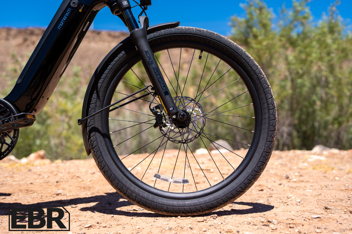 Momentum Vida E+ EX front wheel close-up detail shot