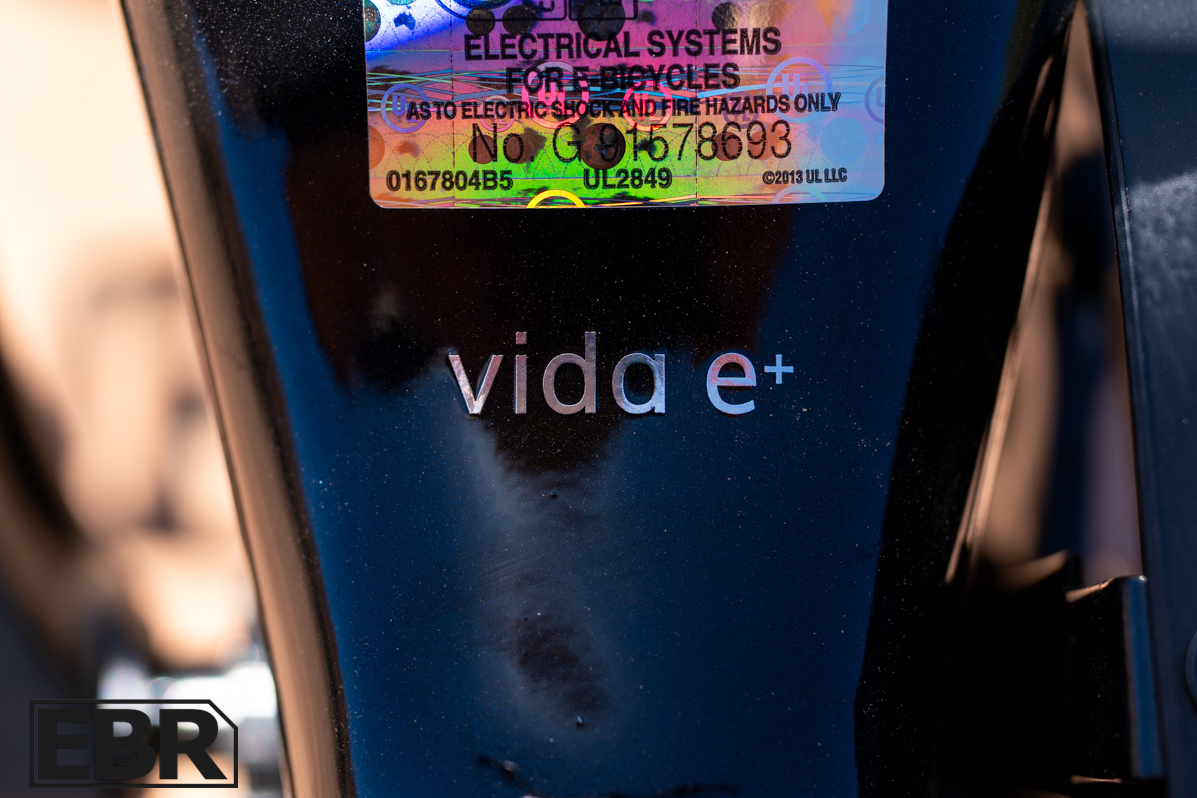 Momentum Vida E+ EX electric bike logo badge