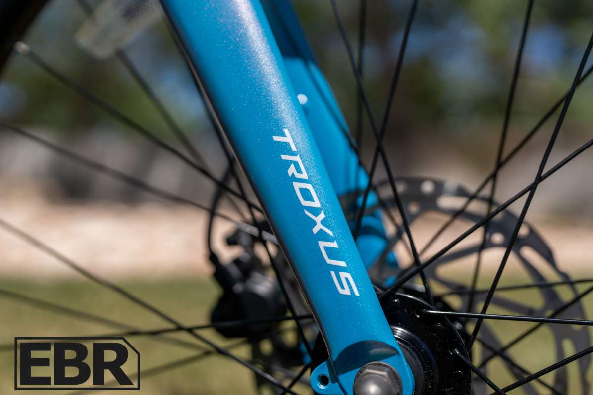 Troxus Trax Whim IQ electric bike brand logo